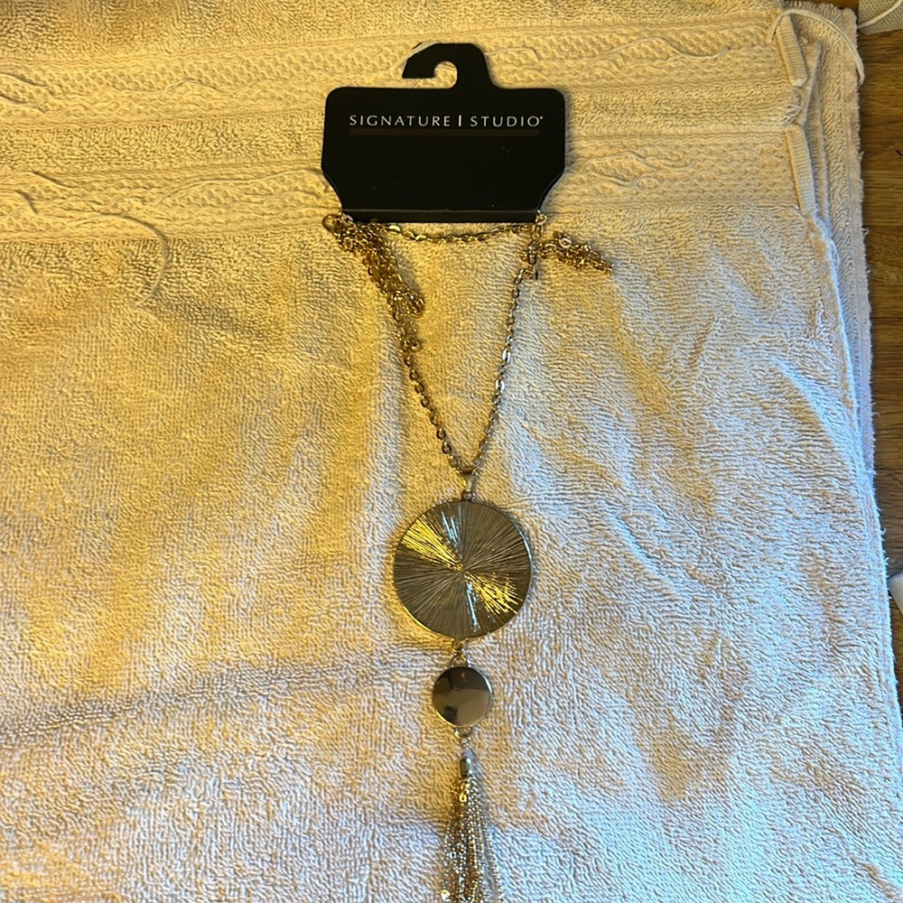 Signature studio gold color necklace. Original price $20